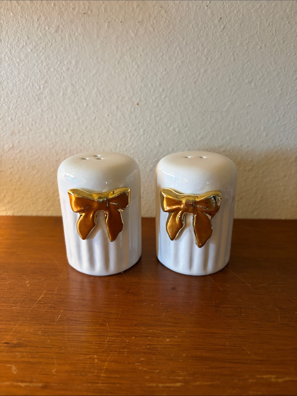 Kirklands White Ceramic Salt and Pepper Shakers with Gold and Brown Bows